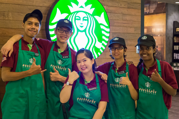 Group photo of deaf partners with store manager Evonne (middle)