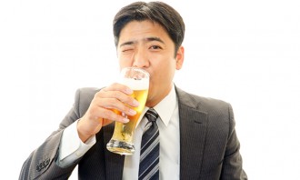 Businessman enjoying a beer